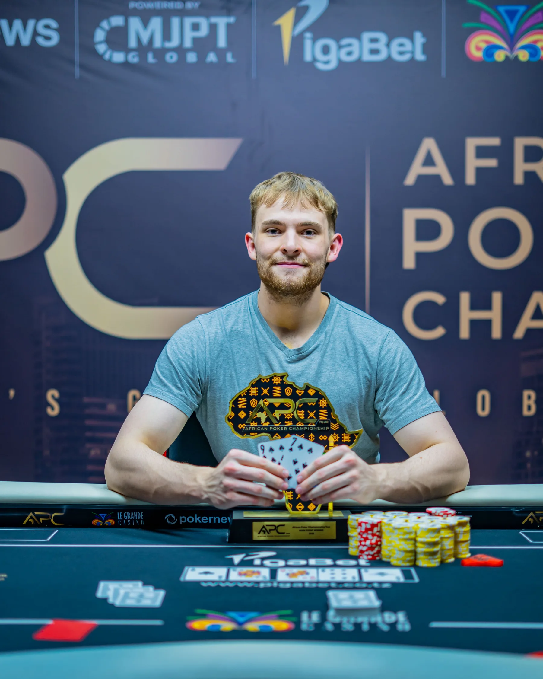 APC Main Event champion with the trophy